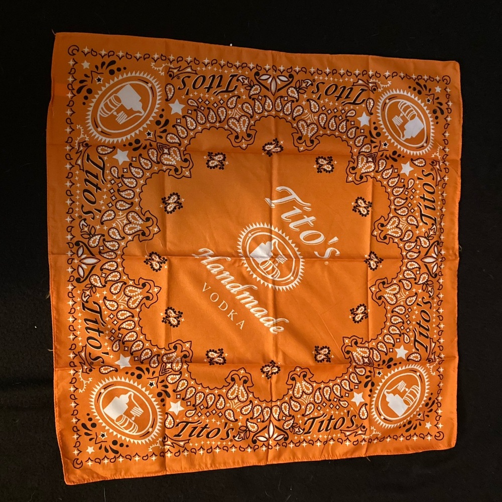 Two brand new orange Tito’s vodka bandanas.